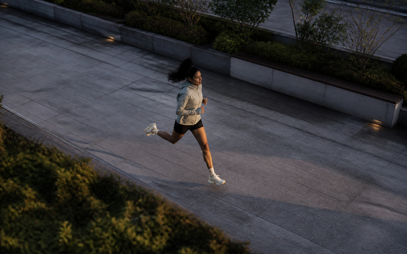 Runner crossing a rooftop garden