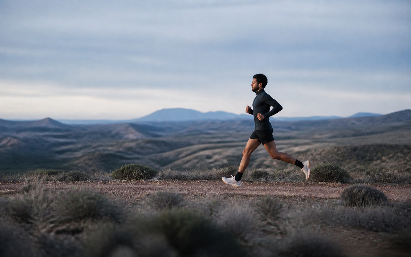 Runner moving through low rolling hills